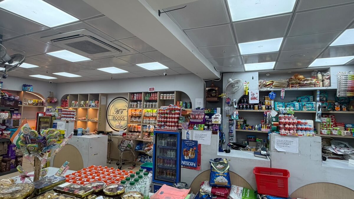 AT Foods counter with dry fruits and namkeen at Ahinsa Traders